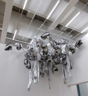 "Untitled (Living Sculpture)" (1966), by Italian artist Marisa Merz. The sculpture comprises c. 30 aluminium tubes and baubles twisted and interlinked around a frame of steel wires and suspended from the gallery ceiling.