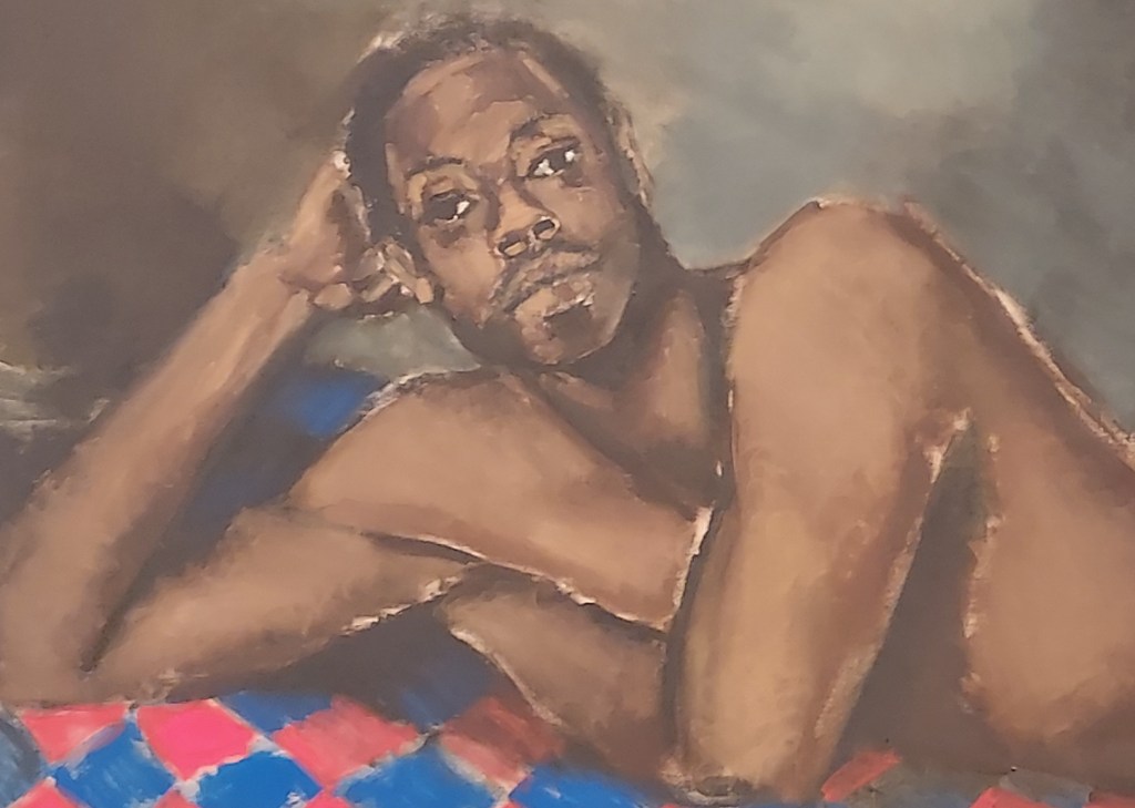 Detail of the oil painting "Tie the Tempest to the Trojan" (2016), by Lynette Yiadom-Boakye. A man with African heritage is shown reclining on a bed, leaning on his right arm as he stares out from the canvas. He is naked from the waist up. Photo: Carol Ann Dixon.